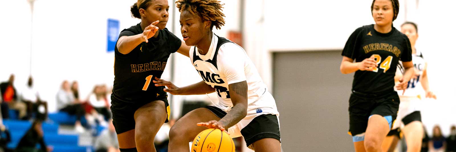 Women's basketball player dribbling