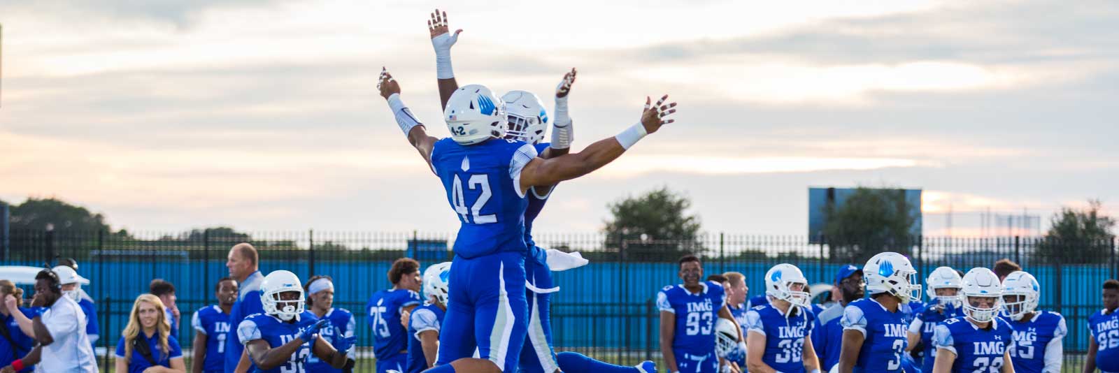 IMG football athletes celebrating