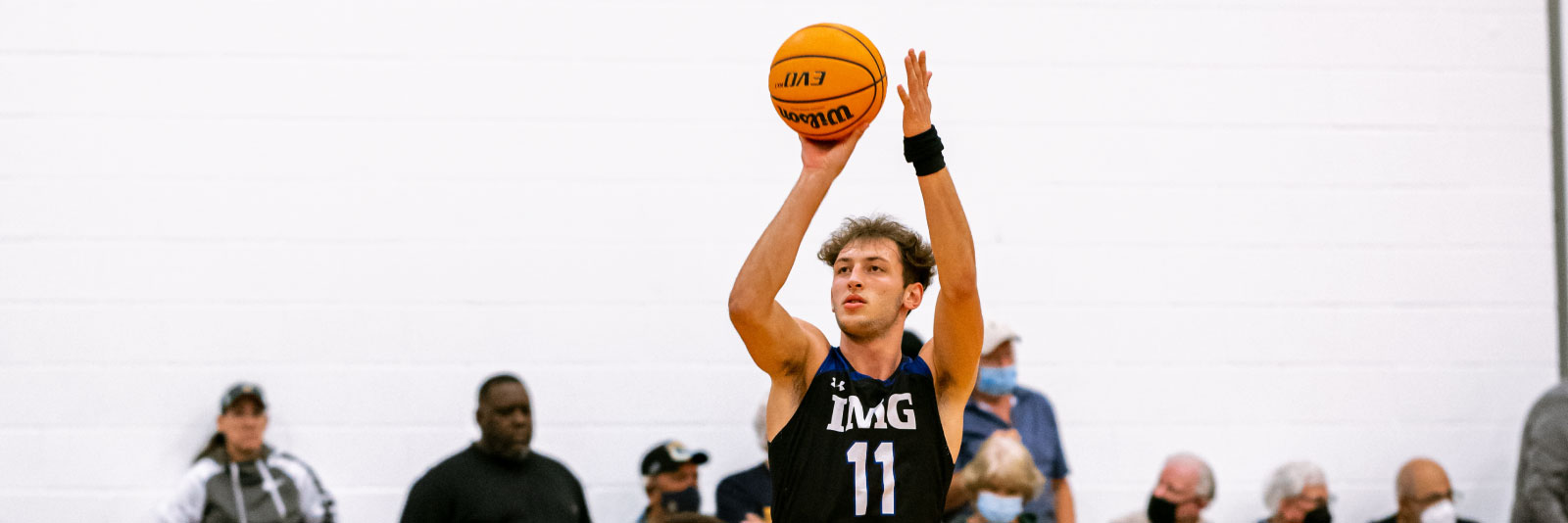 Male basketball player taking a shot