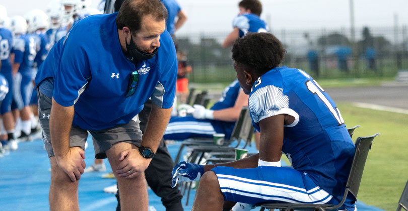 Coach talking to athlete