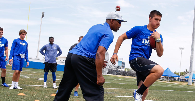 Football coaches on field